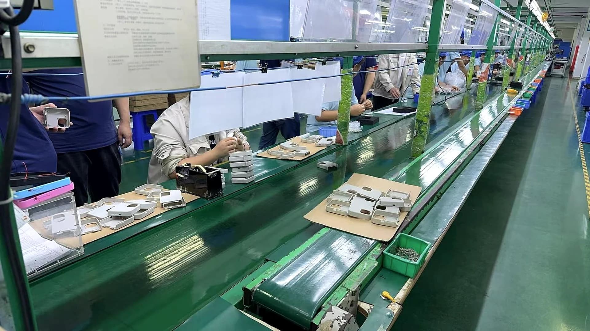 SOOLRA™ controller cases moving through a hands-on assembly line